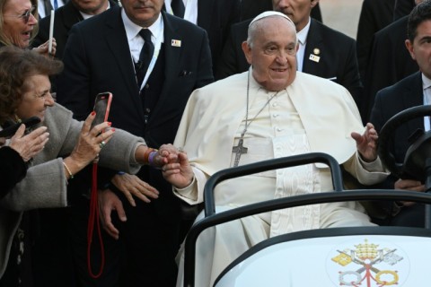 Francis appeared in good spirits, with a ready smile throughout the day's events