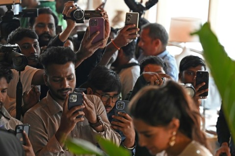 A group of paparazzi take pictures and videos of Bollywood actress Sara Ali Khan, outside a hotel in Mumbai