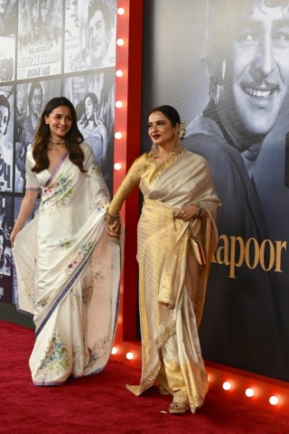 Bollywood actors Alia Bhatt (L) and Rekha at an event marking the 100th birth anniversary of legendary Indian actor and filmmaker Raj Kapoor