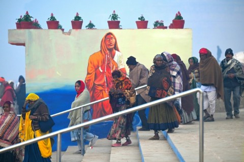 Hindu pilgrims walk along the banks of Sangam, the confluence of Ganges, Yamuna and mythical Saraswati rivers, ahead of the Maha Kumbh Mela festival in Prayagraj