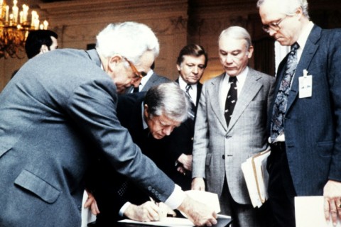 President Jimmy Carter signs an order blocking Iranian funds in US banks in November 1979, days after Iranian students stormed the US embassy in Tehran, taking US hostages