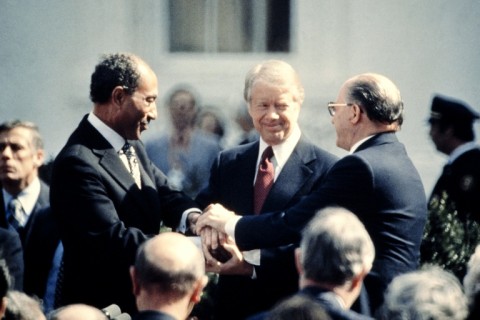 Jimmy Carter congratulates Egypt's Anwar al-Sadat (L) and Israel's Menachem Begin (R) in March 1979 outside the White House after signing the US-sponsored Camp David accords