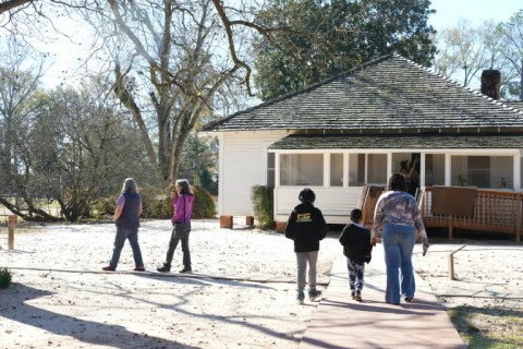 People visit former president Jimmy Carter's boyhood home on December 30, 2024 following his death