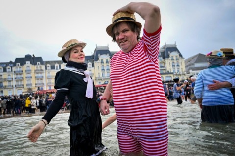 Hardy souls braved the cold waters of the Channel in Cabourg, northern France, for the last swim of the year