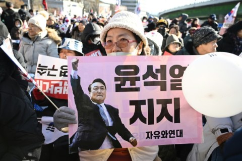 Supporters of impeached South Korean President Yoon Suk Yeol gathered outside his residence after a court issued an arrest warrant for him