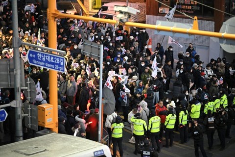 Police stood guard in front of a rally to support Yoon outside his residence