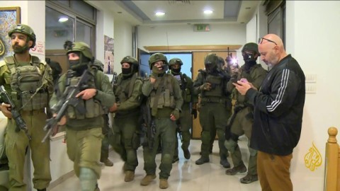 Israeli soldiers enter Al Jazeera's Ramallah office in September, 2024 to issue a 45-day closure order