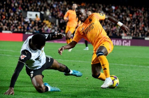 Real Madrid's Brazilian forward Vinicius Junior (R) is likely to play despite his red card against Valencia