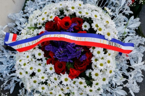 French President Emmanuel Macron and Paris Mayor Anne Hidalgo both laid wreaths near the publication's former offices