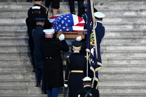 The casket of former US President Jimmy Carter is carried up the US Capitol steps