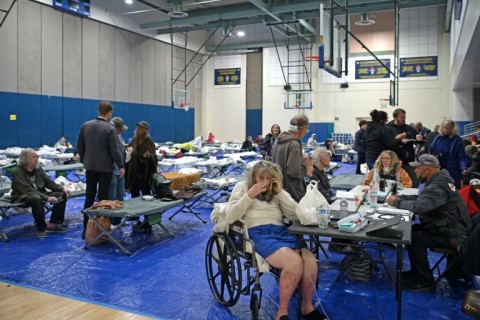 Evacuees from the Palisades fire at an evacuation and shelter center at Westwood Recreation Center in Los Angeles