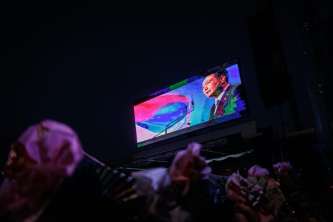 A screen installed by supporters of impeached South Korean President Yoon Suk Yeol displays his image near his residence