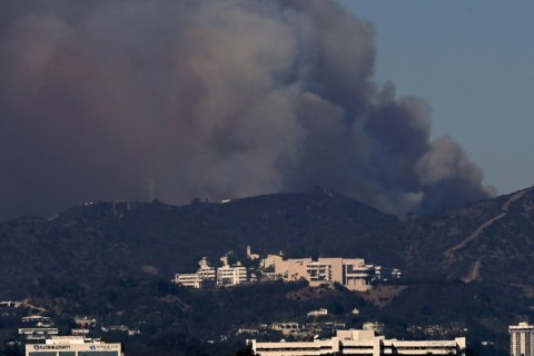 Smoke from the Palisades Fire rises over the Getty Museum 