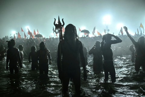 Sadhus or Hindu holy men take part in a mass bathing ritual to mark the Kumbh Mela festival 