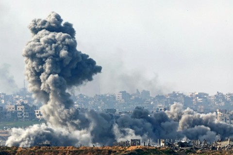 This picture taken from the Israeli side of the border with the Gaza Strip shows smoke plumes rising from explosions in the northern Gaza Strip on January 14, 2025