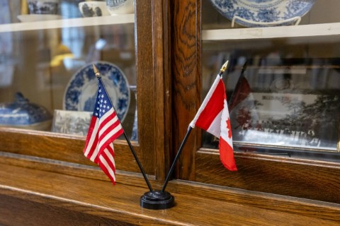 American and Canadian flags are both displayed in their shared library