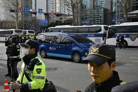 There was a heavy police presence as President Yoon Suk Yeol arrived at the Seoul court