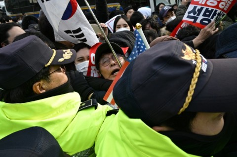 The president's supporters rallied outside the court and scuffled with police as he arrived for the hearing