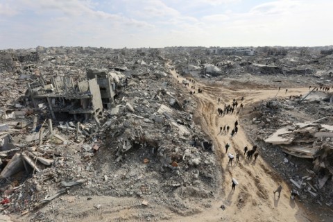 Displaced Palestinians return to the war-devastated Jabalia refugee camp in northern Gaza, shortly before the truce took effect