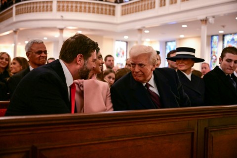 US President-elect Donald Trump speaks with Vice President-elect JD Vance (L) during a church service at St. John's Episcopal Church, Lafayette Square in Washington, DC, January 20, 2025.