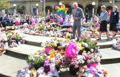 Britain's King Charles III views tributes placed outside Southport Town Hall following the July 29, 2024 attack at a childrens' Taylor Swift themed dance party