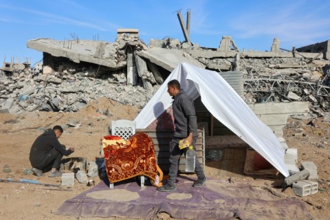 Palestinians set up a tent on the rubble of bombed-out houses in Jabalia in the northern Gaza Strip