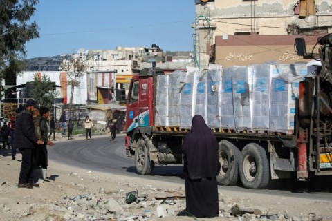 A truck carrying much needed humanitarian aid drives through southern Gaza's Rafah