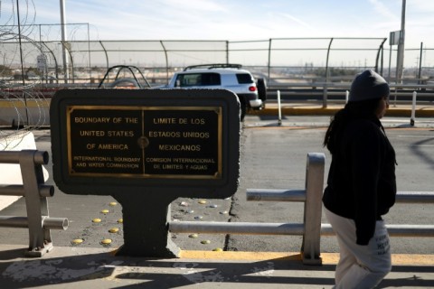 A woman crosses into Mexico from El Paso, Texas