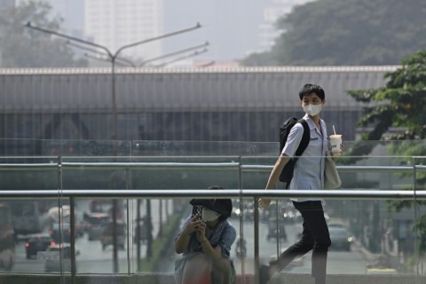 Many Bangkok residents wore masks to combat the effects of air pollution