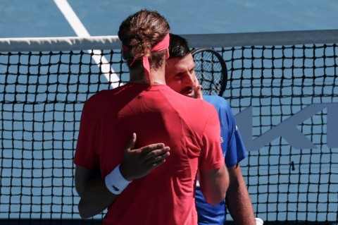 Novak Djokovic is consoled by Alexander Zverev after retiring from their semi-final