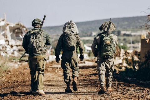 A handout picture from the Israeli military of its troops in southern Lebanon, where they had been due to withdraw from this week