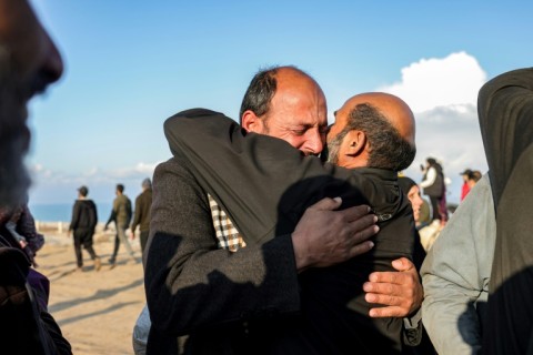 A man embraces another in Gaza City after having crossed the Netzarim corridor from the southern Gaza Strip 