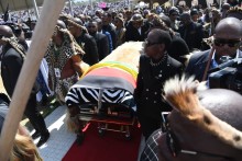 Prince Mangosuthu Buthelezi's coffin being carried onto the podium. GCIS