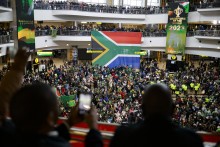 Supporters wait ahead of the South African rugby team's arrival at the OR Tambo International airport in Ekurhuleni on October 31, 2023, after they won the France 2023 Rugby World Cup final match against New Zealand.