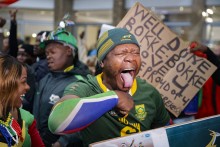 A supporter reacts ahead of the South African rugby team's arrival at the OR Tambo International airport in Ekurhuleni on October 31, 2023, after they won the France 2023 Rugby World Cup final match against New Zealand.