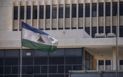 A picture taken in Maseru, on January 31, 2020 shows the flag of Lesotho outside the Parliament building.