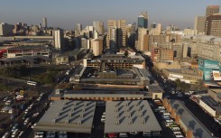 This aerial view shows the Johannesburg skyline and the Bree taxi rank in Newtown, on May 7, 2020.