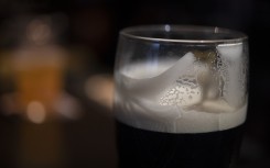 File: A head of foam coats the glass of a daft beer. FRED TANNEAU / AFP