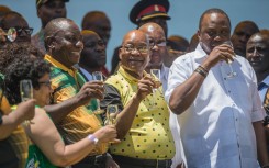 African National Congress (ANC) Deputy Secretary-General Jessie Duarte, ANC President Cyril Ramaphosa, President of South Africa Jacob Zuma and President of Kenya Uhuru Kenyatta toast at Absa Stadium in East London, South Africa, during the ANC's 106th-anniversary celebrations on January 13, 2018.