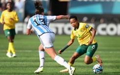 Argentina's defender #13 Sophia Braun (L) fights for the ball with South Africa's forward #08 Hildah Magaia during the Australia and New Zealand 2023 Women's World Cup Group G football match between Argentina and South Africa at Dunedin Stadium in Dunedin on July 28, 2023. (Sanka Vidanagama / AFP)