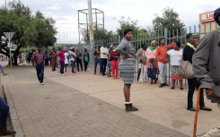 People queueing to receive Sassa social grants.