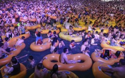 The popular Wuhan Maya Beach Water Park was filled with people frolicking in swimsuits and goggles for an electronic music festival.