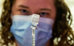 A medical worker prepares the Pfizer-BioNTech Covid-19 vaccine booster to be given to children 12-15 years old at a hospital in Hartford, Connecticut