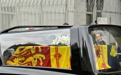 People place flowers for Queen Elizabeth II in Windsor