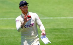 England's Ben Stokes shines the ball -- without using saliva, which has been banned permanently