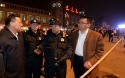 This picture, taken on May 6, 2014, shows then Chinese deputy minister of public security Fu Zhenghua (C) speaking at Beijing railway station