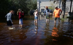 An aerial picture taken on September 29, 2022 shows a flooded neighborhood in the aftermath of Hurricane Ian in Fort Myers, Florida