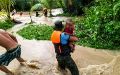 Tropical Storm Nalgae has unleashed flash floods and landslides in parts of the Philippines