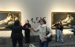 Two climate activists were detained after each glued a hand to a painting in the Madrid museum 