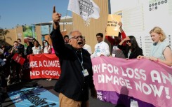 Climate activists stage a protest outside the Sharm el-Sheikh International Convention Centre on Friday